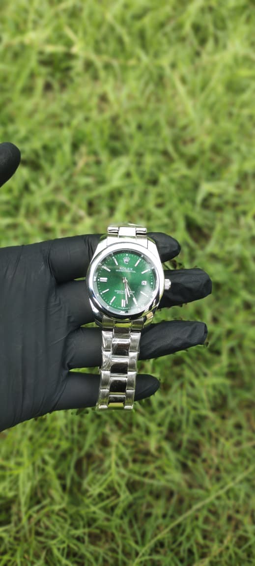 Rolex Silver with Green Dial